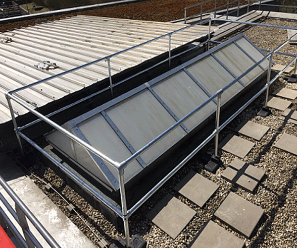 larger rooflight cover over a large raised 6 pane rooflight on a roof
