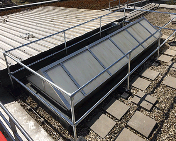 larger rooflight cover over a large raised 6 pane rooflight on a roof